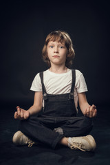 child emotionally posing on camera in the Studio on a white background