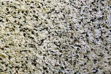 A woven Mat of reeds or straw-yellow in color. The texture of dry cane. Light yellow.