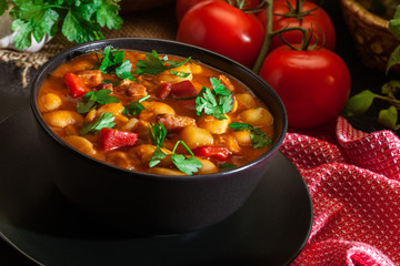 White bean soup with potatoes, tomatoes, paprika, and bacon
