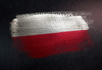 Poland Flag Made of Metallic Brush Paint on Grunge Dark Wall