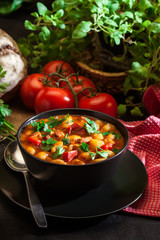 White bean soup with potatoes, tomatoes, paprika, and bacon