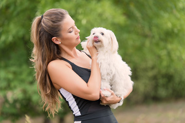 Bichon bolognese dog with beautiful in the park