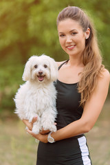Bichon bolognese dog with beautiful in the park