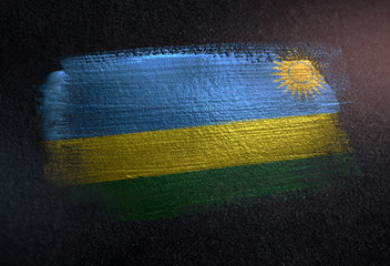 Rwanda Flag Made of Metallic Brush Paint on Grunge Dark Wall