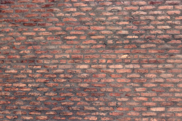 Red brick wall texture grunge background may use to interior design