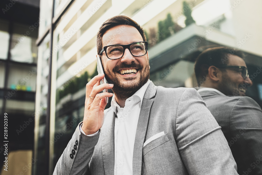 Wall mural businessman using phone