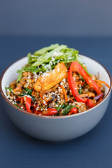 A plate of a wok rice on the dark background