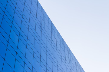 Fototapeta na wymiar Blue Glass building Modern office building