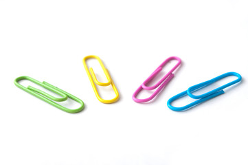 closeup of colorful paperclips on white background