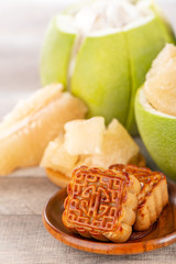 fresh and peeled pomelo(shaddock), grapefruit with slices and mooncake in mid-autumn festival(moon festival)