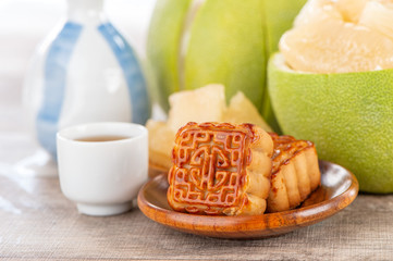 fresh and peeled pomelo(shaddock), grapefruit with slices and mooncake in mid-autumn festival(moon festival)