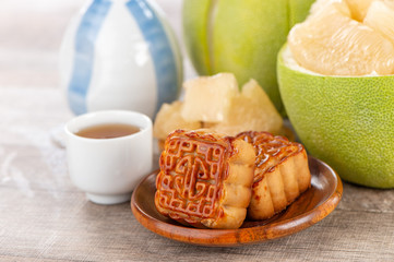fresh and peeled pomelo(shaddock), grapefruit with slices and mooncake in mid-autumn festival(moon festival)