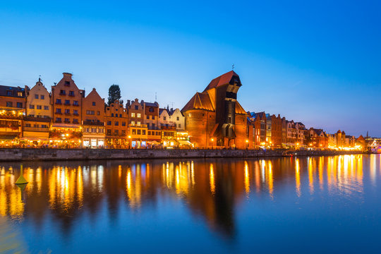 Old town of Gdansk reflected in Motlawa river at dusk, Poland