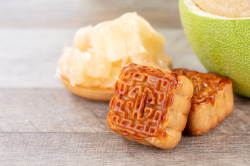 fresh and peeled pomelo(shaddock), grapefruit with slices and mooncake in mid-autumn festival(moon festival)