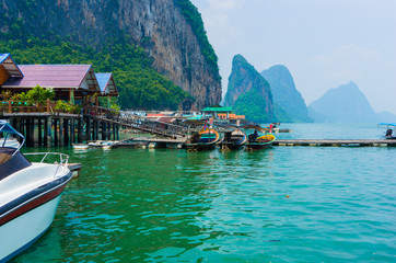 Fototapeta na wymiar Thailand nature sea boats fishing village on the water