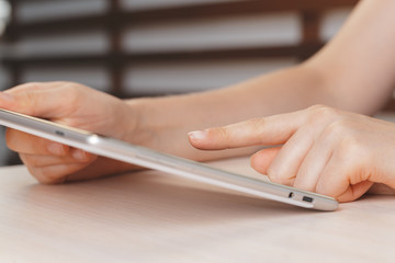 Fototapeta premium woman holding digital tablet, closeup