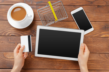 Woman shopping using tablet pc and credit card