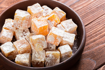 Turkish delight on a wooden table.