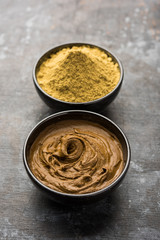 Henna / Mehandi powder and paste. Prepared for Hair colouring or for tattoo on hand in Indian weddings/festivals. selective focus