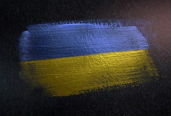 Ukraine Flag Made of Metallic Brush Paint on Grunge Dark Wall