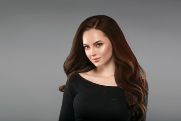 Fototapeta premium Brunette with perfect hair. Woman beautiful portrait with healthy long hairstyle curly and perfect.