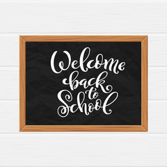 Welcome back to school hand-drawn lettering background.
