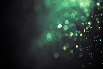 bokeh of water fly and lights on black background,