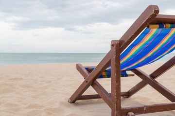 Beach chair on the sand with sea and sky