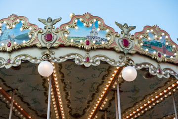 Children's carousel in the center of Moscow. Two-storey carousel with horses