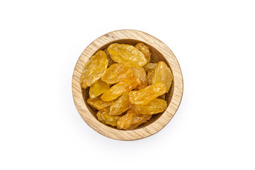 Lot of whole dry golden raisins sultana variety with wooden bowl flatlay isolated on white background