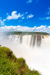 View of the waterfall on the Iguazu river, located on the border of Brazil and Argentina. Copy space for text. Vertical.