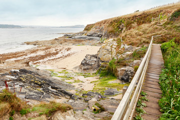 South west coastal path, bridge across secluded cove at St Antony's head, Roseland Penisula,...