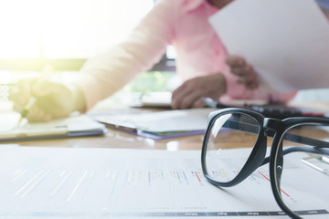 Administrator business man financial inspector and secretary making report, calculating or checking balance. - Business Concept