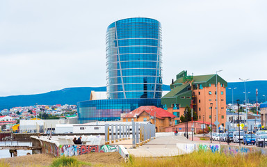 PUNTA ARENA, CHILE - JANUARY 4, 2018: View of the glass building against the background of the...