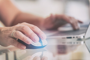 Woman working on her laptop at home office