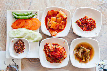 Cabbage, daikon Kimchi and small portion korean food side dishes