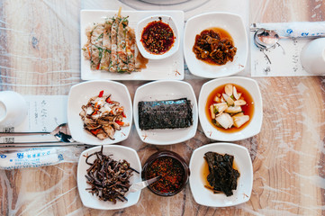 Buchimgae Pajeon Korean pancake, Kimchi and small portion of side dishes