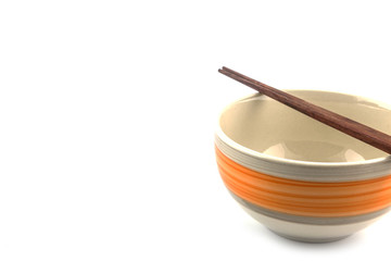 white ceramic bowl and wooden chopsticks isolated on white