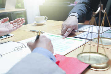 Administrator business man financial inspector and secretary making report, calculating or checking balance.