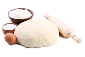 Fototapeta na wymiar Raw dough with rolling pin, egg and flour isolated on white background