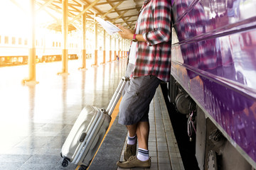 Traveler waiting for journey travel at train station. - Travel and transportation concept.