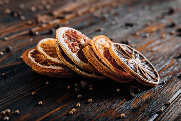Dried fruits with spices on wooden background