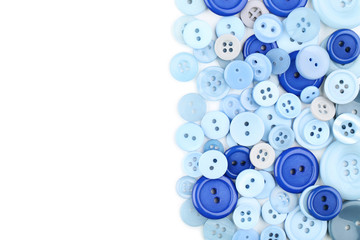Blue sewing buttons on white background