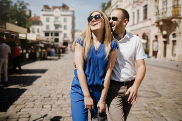 Beautiful happy couple embracing in the city.  