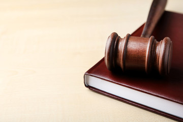 Judge gavel with book on wooden table