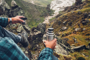 Hiking Adventure Tourism Vacation Holiday Concept. Unrecognizable Traveler Man Holding Thermos In...
