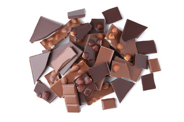 Chocolate pieces with hazelnuts isolated on white background