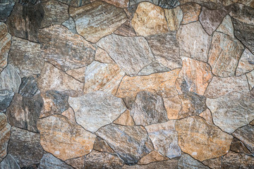 Background and texture of stacked stone wall background