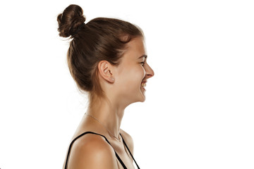 Profile of young happy woman on white background
