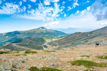 Fototapeta na wymiar A view of some of the Guadarrama (Spain) mountains in summer, with a ski resort installations in the front